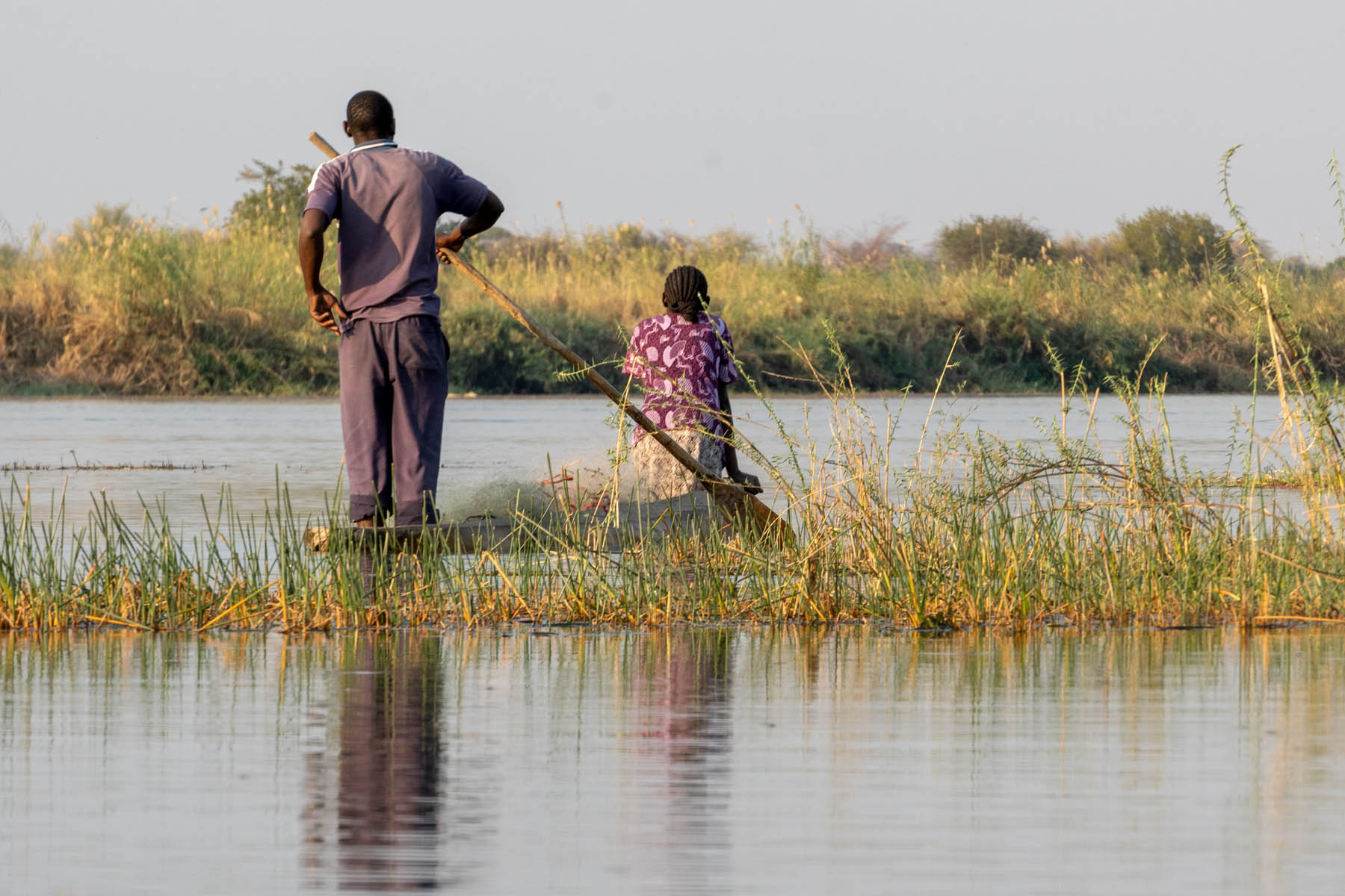 Fischer im Okavango Delta Namibia